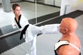 Young brave and physically disabled woman training para-taekwondo