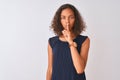 Young brazilian woman wearing blue dress standing over isolated white background asking to be quiet with finger on lips Royalty Free Stock Photo