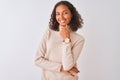 Young brazilian woman wearing turtleneck sweater standing over isolated white background looking confident at the camera smiling Royalty Free Stock Photo