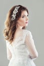 Young bride. Beautiful woman with makeup and bridal hair