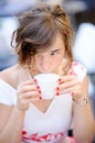 Young bride drinking coffee during her wedding day Royalty Free Stock Photo