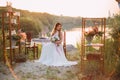 Young bride - elegant, stylish , sitting at the table on a chair Royalty Free Stock Photo