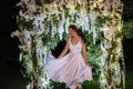 young bride on the evening illuminated arch