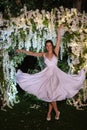 young bride on the evening illuminated arch