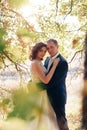 Young bride and groom walking in autumn Park with yellow leaves Royalty Free Stock Photo