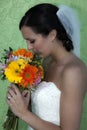 Young bride profile holding flowers