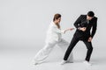 Young bride pulling handcuffs on hand