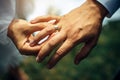 Young bride put a gold wedding ring on the groom`s finger, close-up. Wedding ceremony, exchange of rings. On the hand of man Royalty Free Stock Photo