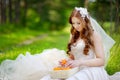 Young bride sitting on a grass Royalty Free Stock Photo