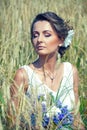 Young bride sitting in the grass Royalty Free Stock Photo