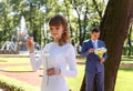 Young bride tears off chamomile petals to tell fortunes