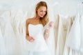 Shes going to make a beautiful bride. A young bride trying on her wedding dress - Copyspace.