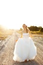 Young Bride Walking on a Country Road Royalty Free Stock Photo