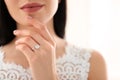 Young bride wearing beautiful engagement ring