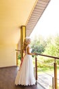 Young bride in wedding dress holding bouquet Royalty Free Stock Photo