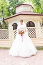 Young bride in wedding dress holding bouquet Royalty Free Stock Photo