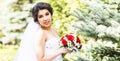 Young bride in wedding dress holding bouquet Royalty Free Stock Photo