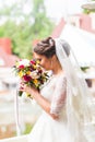 Young bride in wedding dress holding bouquet Royalty Free Stock Photo