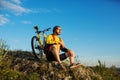 young bright man on mountain bike