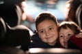 A young brother and sister enjoying a car ride together, immersed in the adventure of travel Royalty Free Stock Photo