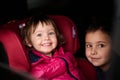 A young brother and sister enjoying a car ride together, immersed in the adventure of travel Royalty Free Stock Photo