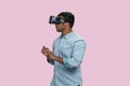 Young brown southasian man in vr headset. Royalty Free Stock Photo