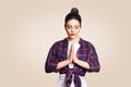 Young brunete woman practising yoga, holding hands in namaste and keeping her eyes closed. Caucasian girl meditating Royalty Free Stock Photo