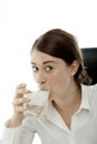 Young brunette business woman is drinking water Royalty Free Stock Photo