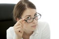 Young brunette business woman squint over glasses Royalty Free Stock Photo