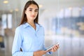 Young brunette businesswoman or student girl looking at camera