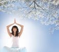 A young brunette Caucasian meditating woman