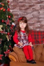 Young brunette dolly lady girl stylish dressed in red dress costume chequers check tartan skirt strap shoes smiling posing sitting Royalty Free Stock Photo