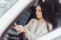 Young brunette european concentrated woman driving car Royalty Free Stock Photo