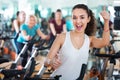 Young brunette in exercise bikes class Royalty Free Stock Photo
