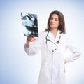 A young brunette female doctor with an x-ray Royalty Free Stock Photo