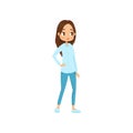 Young brunette girl with big shiny eyes. Teenager in blue shirt and skinny jeans. Stylish casual outfit. Flat vector Royalty Free Stock Photo