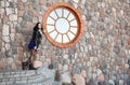 Young girl near the old stone wall Royalty Free Stock Photo