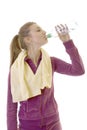 Young brunette girl drink water after exercising