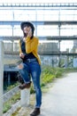 Young brunette girl with a mobile phone in park, outside Royalty Free Stock Photo