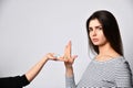 Young brunette girl refuses to take pills medicine pills offered on hand