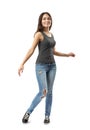 Young brunette girl wearing casual jeans and t-shirt turning isolated on white background