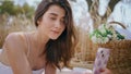 Young brunette making selfie holding mobile phone at field close up. Lady laying Royalty Free Stock Photo