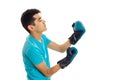 Young brunette man in blue shirt practicing boxing in gloves isolated on white background Royalty Free Stock Photo