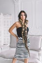 Young brunette with a snake python Royalty Free Stock Photo