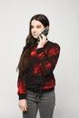 Young brunette teen girl talking on the phone Royalty Free Stock Photo