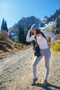 The young brunette thought on the mountain road. Autumn in the mountains Royalty Free Stock Photo