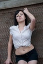 Young brunette wear tie shirt and belly ring Royalty Free Stock Photo