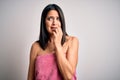 Young brunette woman with blue eyes wearing shower towel after bath over white background looking stressed and nervous with hands Royalty Free Stock Photo