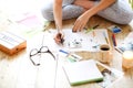 Young brunette woman creating her Feng Shui wish map using scissors Royalty Free Stock Photo