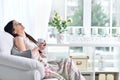 Portrait of young brunette woman drinking tea Royalty Free Stock Photo